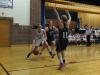 Alex Clarke drives to the hoop between two Hall-Dale defenders. RYAN LEIGHTON/Boothbay Register