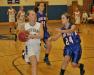 Morgan Crocker drives to the basket against Oak Hill guard Danielle Samson. KEVIN BURNHAM/Boothbay Register