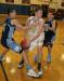 Anthony DiMauro slices between Gavin Arsenault, left, and Hunter Ross on a drive to the basket. KEVIN BURNHAM/Boothbay Register