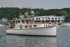 Antique boat Chautauqua cruises past Fisherman's Wharf. The 38-foot sedan cruiser is based in Southport. KEVIN BURNHAM/Boothbay Register