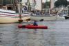 Katherine's son paddles among the tall ships in the inner harbor during Windammers. SUE MELLO/Boothbay Register