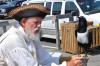 Oreo, an African raven, looks sideways at his handler, Captain Crud Beard, before taking a sip out of a flagon. Pirates of the Dark Rose took over the Boothbay Harbor Whale Park Tuesday morning as part of the 51st Annual Windjammer Days Festival. BEN BULKELEY/Boothbay Register