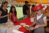 Susan Papineau plates a piece of chicken for a customer. KEVIN BURNHAM/Boothbay Register