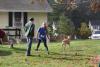 Kathryn Comeaux stretches before the race starts, while holding her dog’s leash. NICOLE LYONS/Boothbay Register