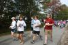 Win Mitchell, right, from Boothbay Craft Brewery, runs with a big smile as the race starts. NICOLE LYONS/Boothbay Register