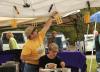 Marc Plaisted of P.B. Honey hangs freshly dipped beeswax candles. SUE MELLO/Boothbay Register