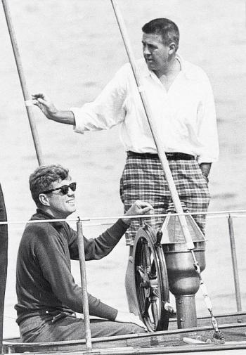 Kennedy enjoys a sail aboard the 62’ Coast Guard training yawl The Manitou. Standing, right, and chosen to take Kennedy's Senate seat vacated for the presidency is his Harvard roommate Ben Smith of Massachusetts. Courtesy of Tom Carbone Archives