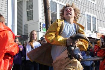 Joey Paollilo helps his team win the Small Fry codfish relay event. SUE MELLO/Boothbay Register
