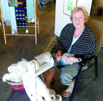 Weaver Ursula Smith of Boothbay was found spinning wool into yarn at Lincoln Art Festival's Arts & Yachts show held at the Boothbay Region Boatyard. GARY DOW/Boothbay Register