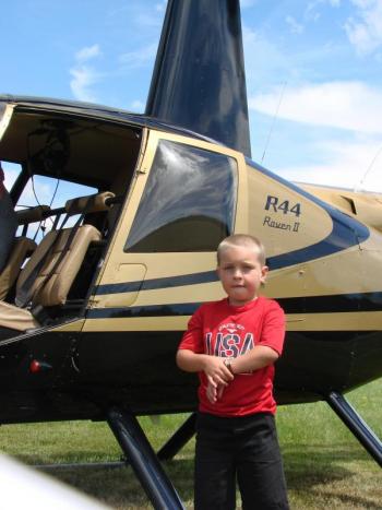 Alexander Colby, 6, of Wiscasset, grandson of Wiscasset Selectman Judy Colby, gets done with his helicopter ride. SUSAN JOHNS/Wiscasset Newspaper