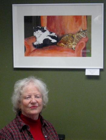 Artist Judy Nixon with framed felines, “Abigail and Emma" now on exhibit at First Federal Savings and Loan in Boothbay Harbor. Courtesy of Sandy Terry